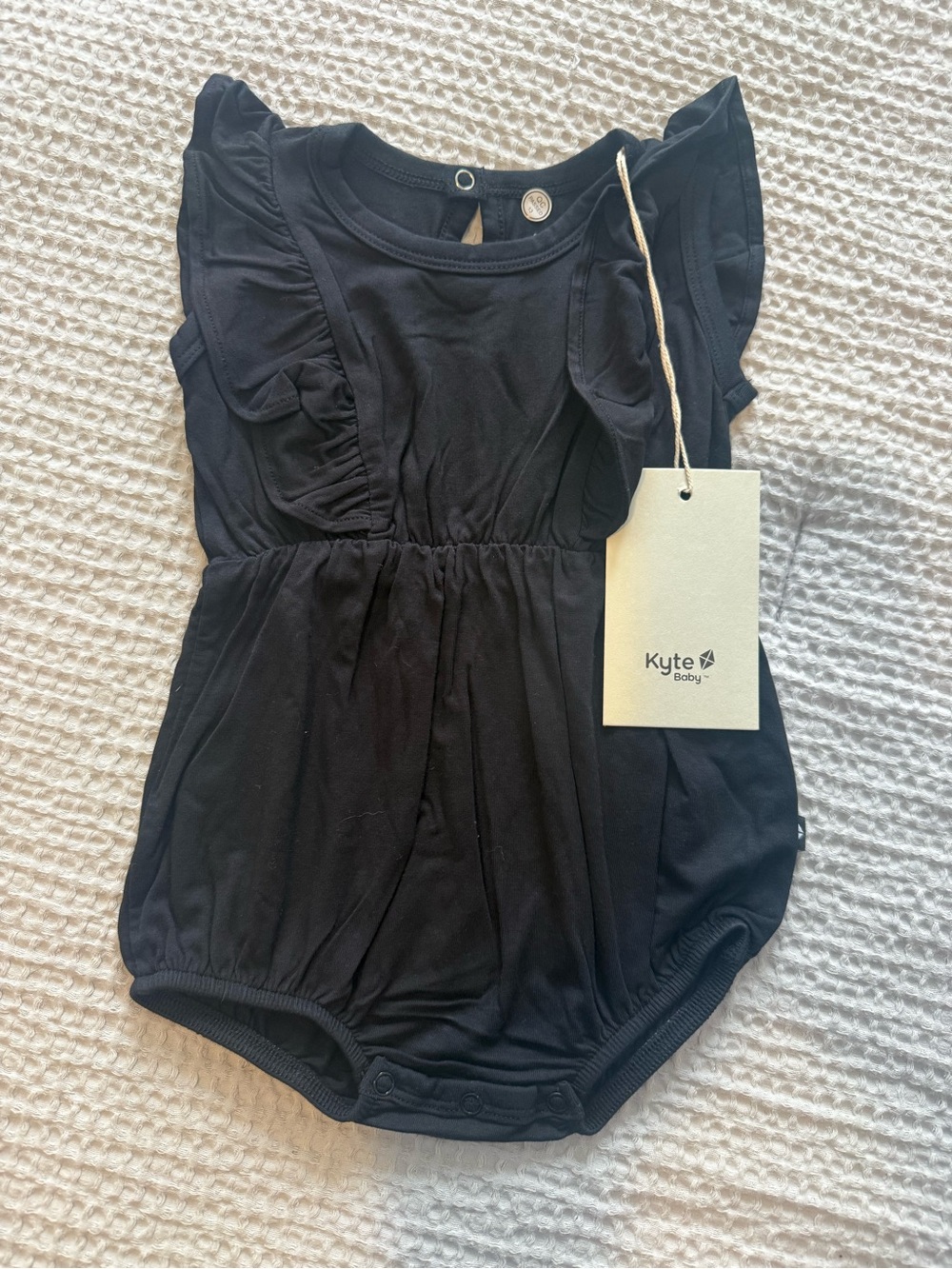 Kyte BABY Black Ruffle Sleeve One-Piece
